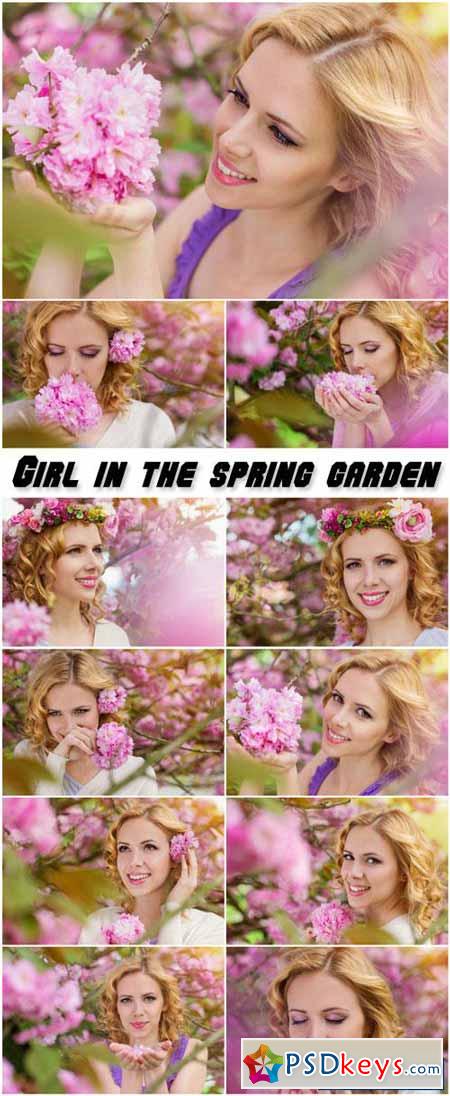 Lovely girl in the lush spring garden