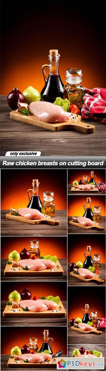 Raw chicken breasts on cutting board - 9 UHQ JPEG