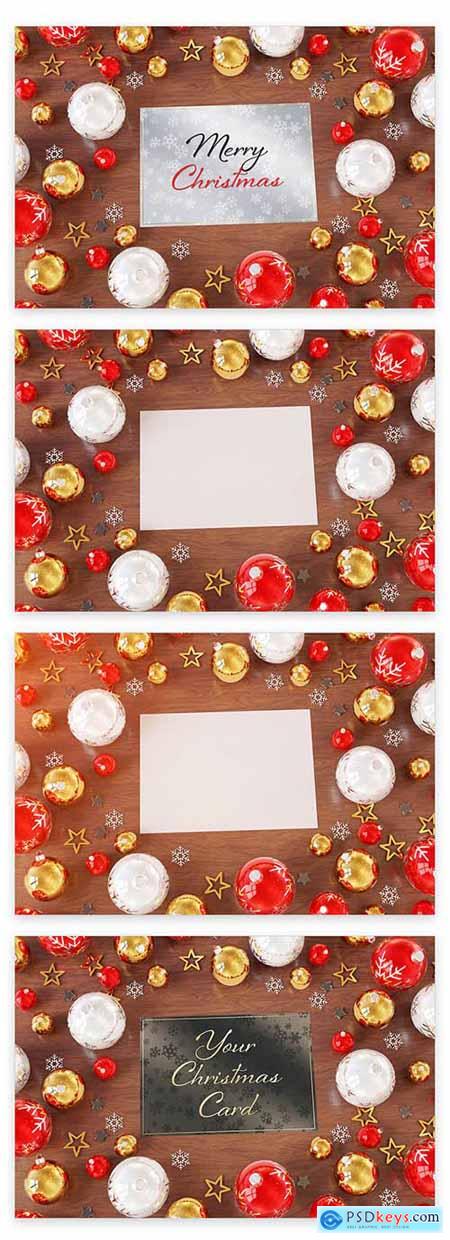 Christmas Card on Wooden Desk with Ornaments Mockup 223233536