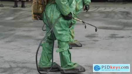 Workers in Bio Viral Hazard Protective Suits Disinfects Floor and Surfaces From Coronavirus 26151436