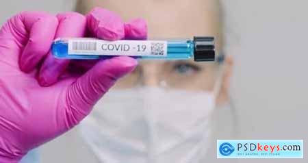Researcher Holding Covid-19 Sample Tube in Hand 26283088