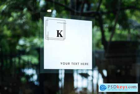 Square white shop sign mockup on a window 844144