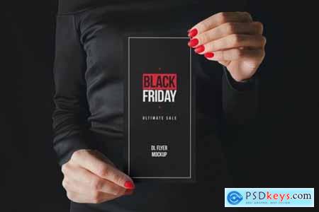 Woman in black holding paper mockup