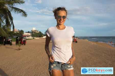 Woman on beach with t-shirt mockup