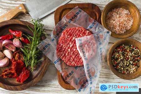 Hamburger raw meat wrapping paper olives jar Food on the table mockup