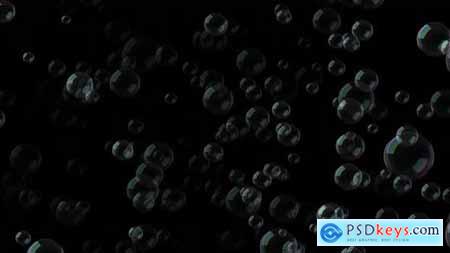 A large number of bubbles fly in the air on a black background 32693280