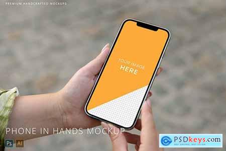 iPhone 12 Pro Max in Woman Hands on Street Mockup 6PWRURV