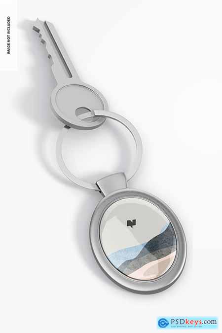 Metallic oval keychain with key mockup