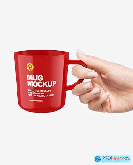 Glossy Mug in a Hand Mockup 89352