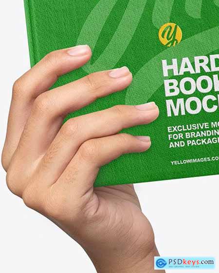 Fabric Hardcover Book in a Hand Mockup 87103