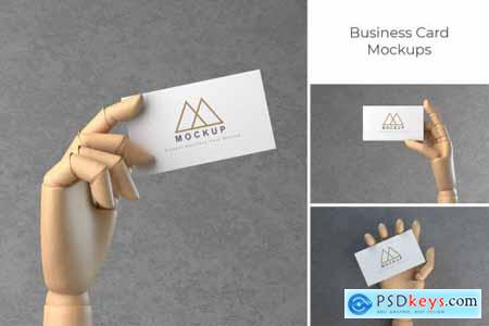 Business Card in Wooden Hand Mockups