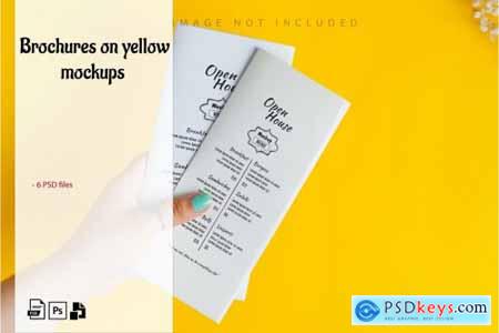 Brochures on yellow mockup set 1