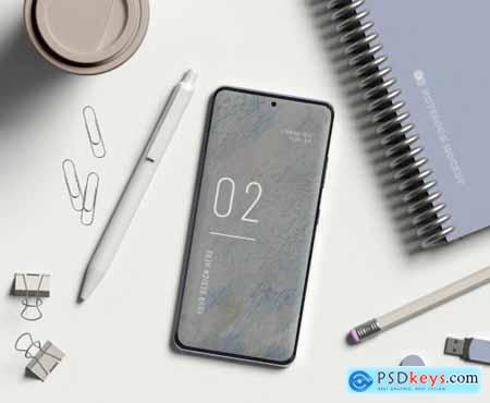 Smartphone with office items mockup