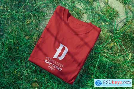 Folded T-Shirt on Grass Realistic Mockup